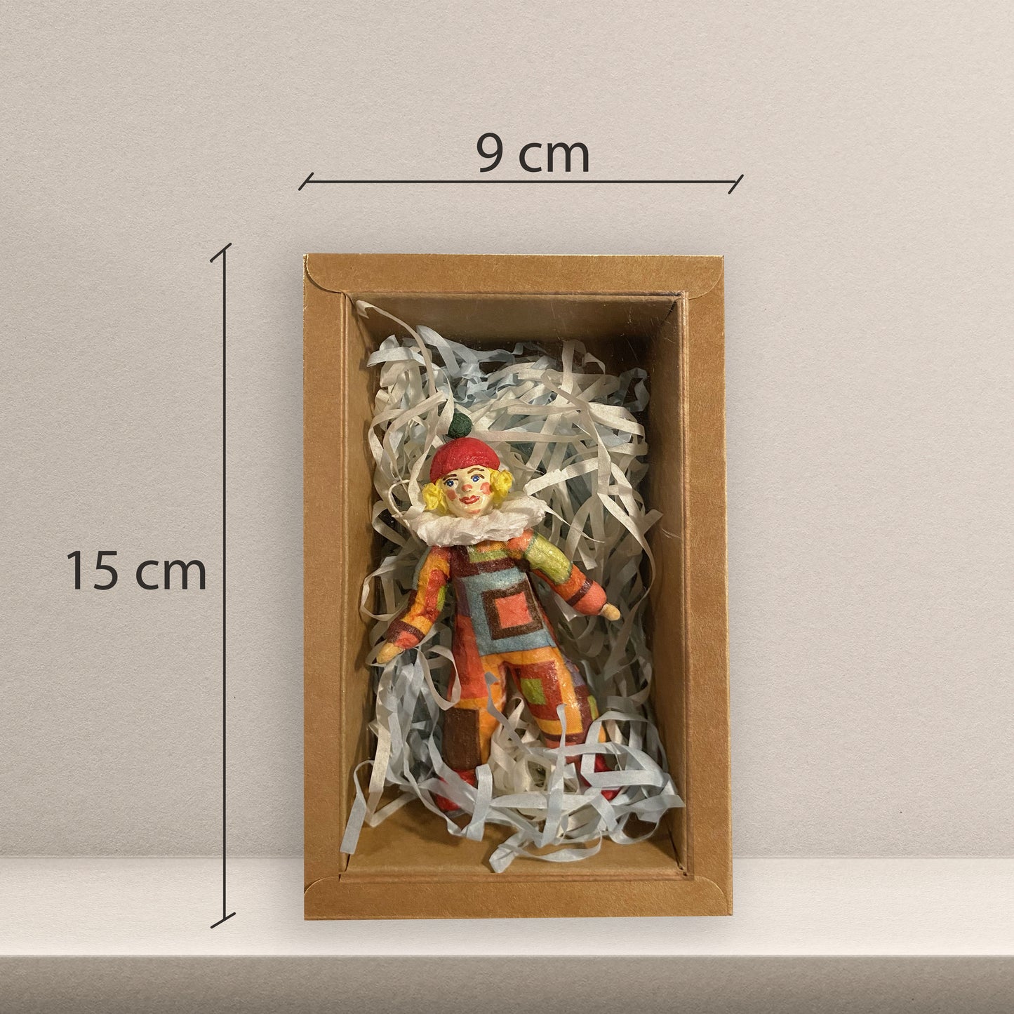 Weihnachtspuppe Harlekin im orangefarben Kostüm