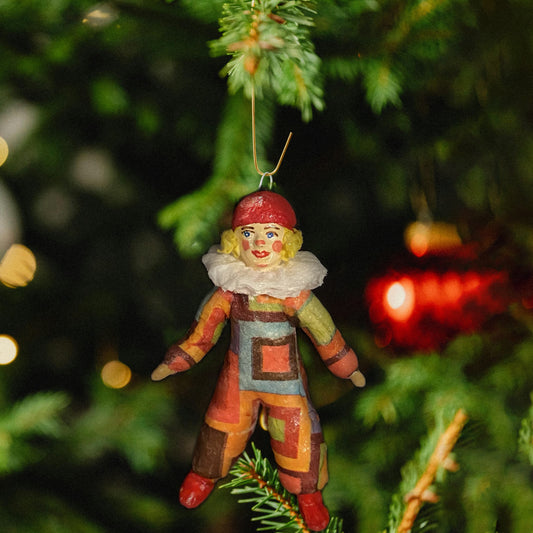 Weihnachtspuppe Harlekin im orangefarben Kostüm