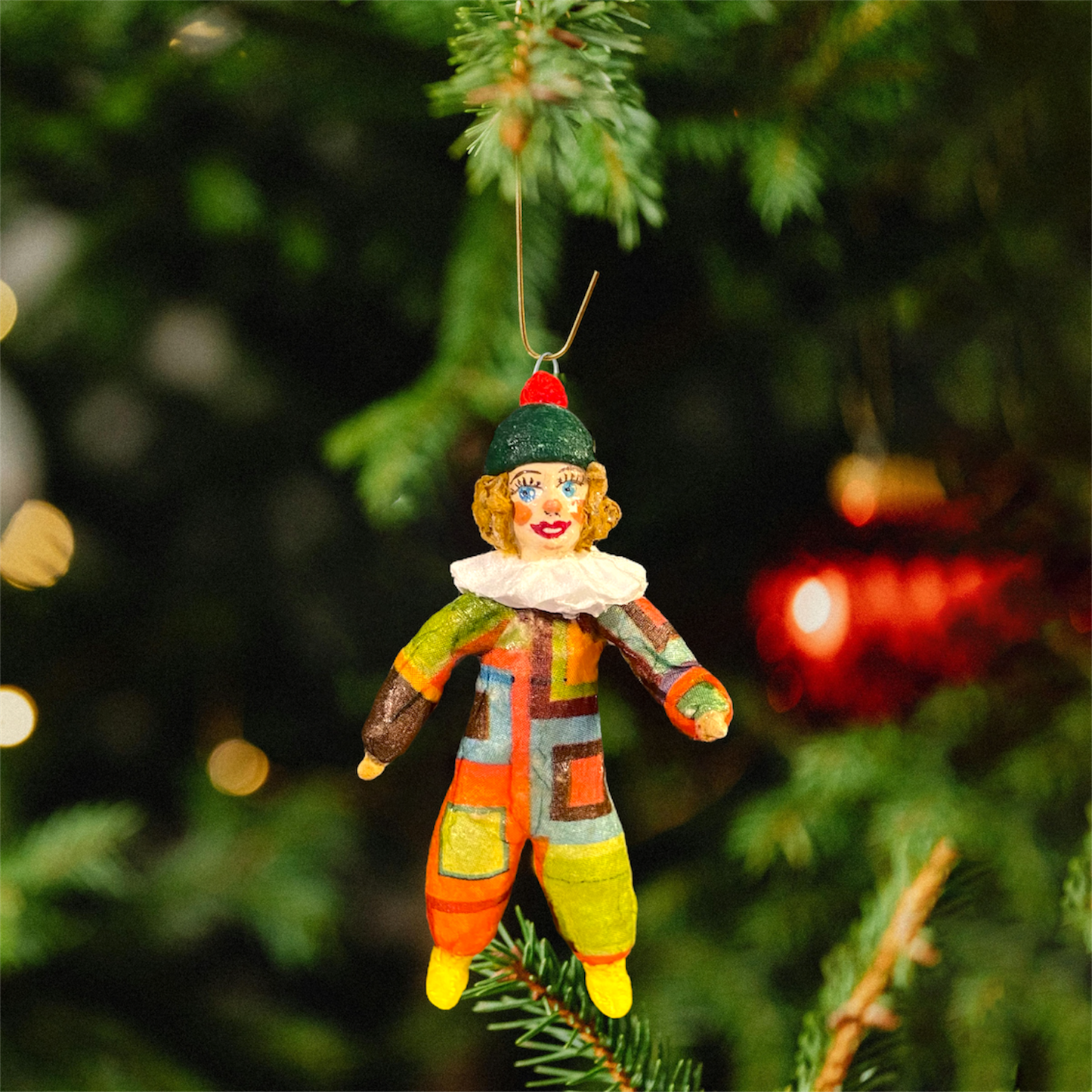 Weihnachtspuppe Harlekin im karierten Kostüm